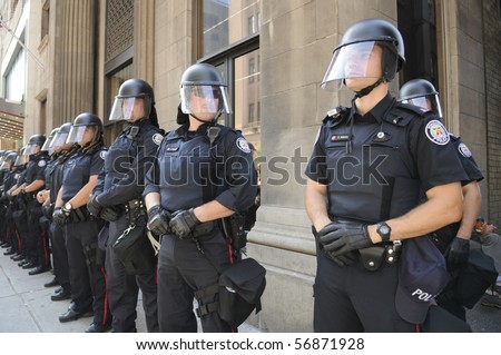 TORONTO-JUNE 25:  Toronto Police officers in riot gear line up  during the G20 Protest on June 25, 2010 in Toronto, Canada.