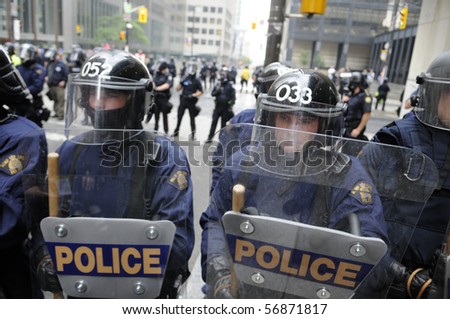 TORONTO-JUNE 26:  Toronto Riot Police  lined up on King-Bay street  during the G20 Protest on June 26, 2010 in Toronto, Canada.