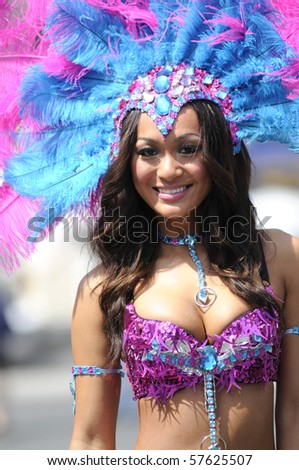 TORONTO - JULY 15: A participant in Pink and Blue costume during the official launch of the 2010 caribana festival at Yonge & Dundas square on July 15, 2010 in Toronto.
