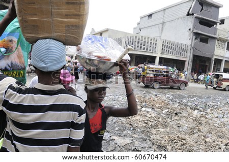 PORT-AU-PRINCE - AUGUST 21: People passing by a  garbage dumping place right in the middle of  Iron Market in  Port-Au-Prince, Haiti on August 21, 2010.