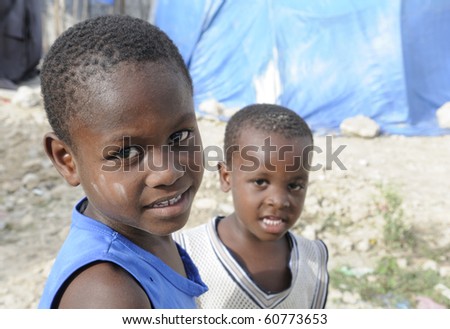 PORT-AU-PRINCE - AUGUST 28:  Unidentified Kids in the Tent Cities has no means of getting basic education, on August 28, 2010 in Port-Au-Prince, Haiti