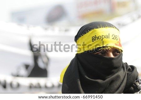BHOPAL- DECEMBER 3 : A Muslim women looks on a different direction  during  a rally to mark the 26th anniversary of the Bhopal Gas Disaster,  in Bhopal - India on December 3, 2010.