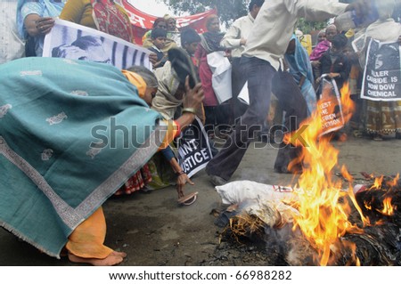 BHOPAL- DECEMBER 2: Angry and violent mob during the rally to mark the 26th year of the Bhopal Gas Disaster in Bhopal - India on December 2, 2010.