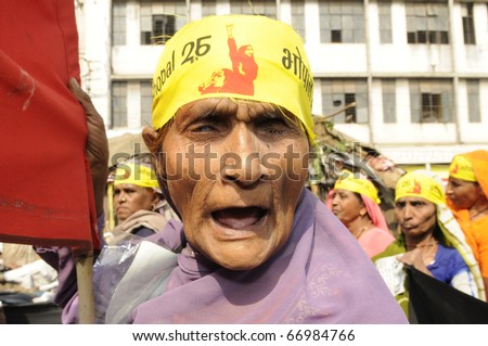 BHOPAL- DECEMBER 3: An old woman gets angry while being photographed during the rally to mark the 26th year of Bhopal Gas Disaster, in Bhopal - India on December 3, 2010.