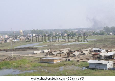BHOPAL - DECEMBER 4: View of the human settlement around the dumping grounds of the Union Carbide gas plant ,where chemical waste was dumped in 1984, in Bhopal - India on December 4, 2010.