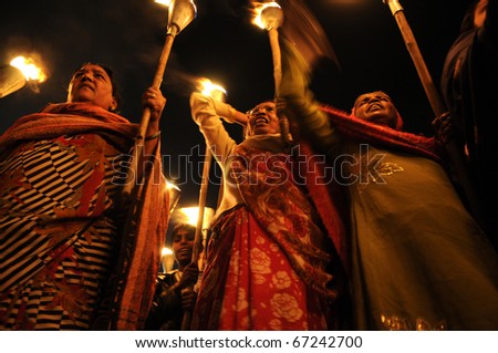 BHOPAL- DECEMBER 2: Rashida Bi( L) along with fellow activists  during the torch rally organized to mark the 26th year of Bhopal gas disaster in Bhopal - India on December 2, 2010.