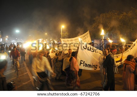 BHOPAL- DECEMBER 2: The rally march  towards it\'s destination  during the torch rally organized to mark the 26th year of Bhopal gas disaster, in Bhopal - India on December 2, 2010.