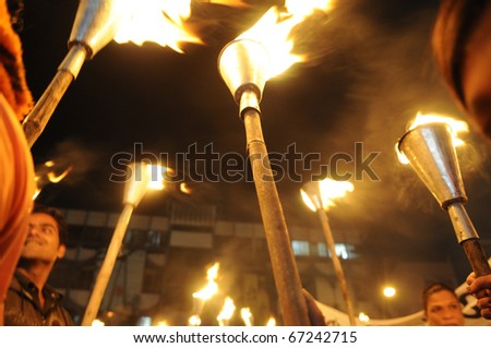 BHOPAL- DECEMBER 2: Protesters hold up their torches during the torch rally organized to mark the 26th year of Bhopal gas disaster, in Bhopal - India on December 2, 2010.