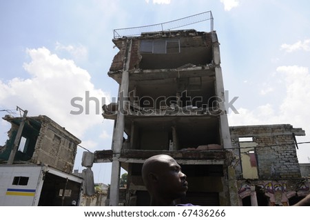PORT-AU-PRINCE - AUGUST 27: A collapsed building in downtown area of the capital which remains  dangerous  even after 7 months from the earthquake in Port-Au-Prince, Haiti on August 27,2010.