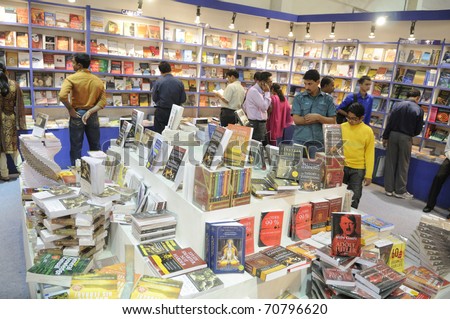 KOLKATA- FEBRUARY 4: Shoppers select books inside a book stall during the 2011 Kolkata Book fair  in Kolkata, India on February 4, 2011.