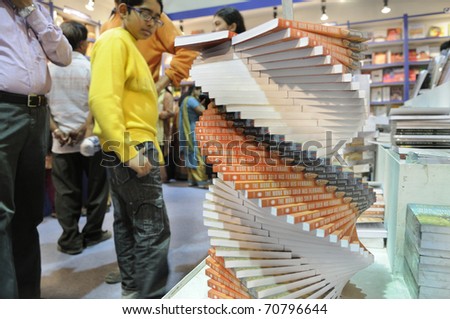 KOLKATA- FEBRUARY 4: An unidentified kid looks at stacks of the book called \