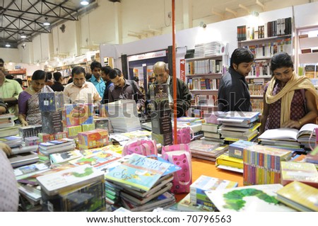 KOLKATA- FEBRUARY 4: Shoppers crowded around a table of books  during the 2011 Kolkata Book fair in Kolkata, India on February 4, 2011.