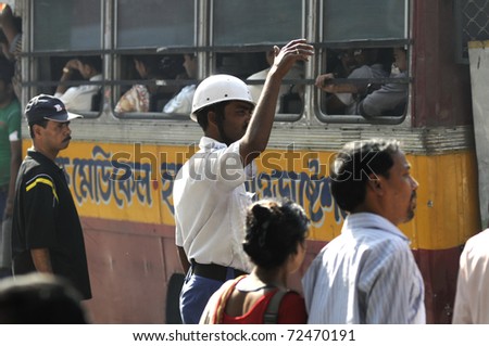 KOLKATA- FEBRUARY 13:  A n active traffic constable during a political rally  in Kolkata, India on February 13, 2011.