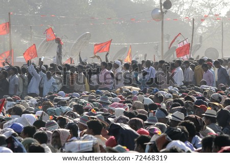 KOLKATA- FEBRUARY 13:  Spectators waiting eagerly for the election agenda to be announced during a political rally  in Kolkata, India on February 13, 2011.