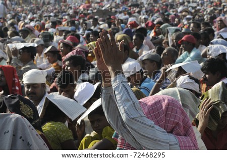 KOLKATA- FEBRUARY 13:   A follower applauding the speaker during a political rally  in Kolkata, India on February 13, 2011.