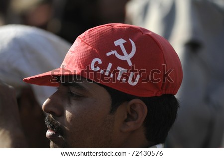 KOLKATA-FEBRUARY 13:A man wearing a red cap of the Trade Union called CITU which is politically attached to the government in West Bengal-during a political rally in Kolkata,India on February 13,2011.