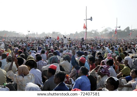 KOLKATA- FEBRUARY 13: Audiences on the floor in scorching heat to listen to the speeches of the communist leadres in Kolkata, India on February 13, 2011.