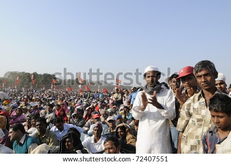KOLKATA- FEBRUARY 13: A Muslim follower clapping during a political rally  in Kolkata, India on February 13, 2011.