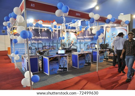 KOLKATA- FEBRUARY 20:  Visitors passes by an Intel booth,during the Information and Communication Technology (ICT) conference and exhibition in Kolkata, India on February 20, 2011.