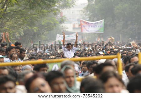 KOLKATA - FEBRUARY 20: A follower of All India Trinamool Congress dancing with joy amidst a crowd during a rally organized to kick the 2011 election campagne, in Kolkata, India on February 20, 2011.