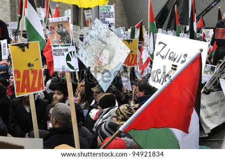 TORONTO - JANUARY 10: Demonstrators marching in  a rally  organized to  condemn the Israel occupation on Gaza on January 10 2009 in Toronto, Canada.