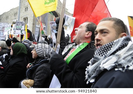 TORONTO - JANUARY 10: Old and young- people of all ages  participating  in a rally to condemn the Israel occupation on Gaza on January 10 2009 in Toronto, Canada.