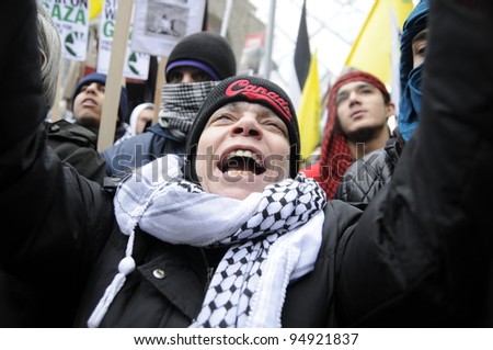 TORONTO - JANUARY 10: An agitated old woman yelling during a rally to condemn the Israel occupation on Gaza on January 10 2009 in Toronto, Canada.