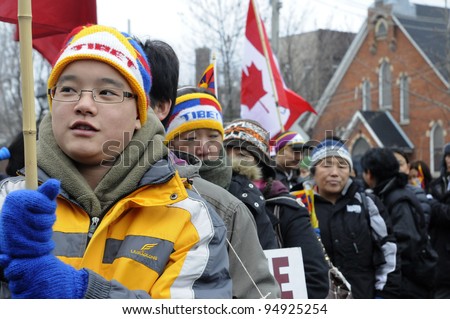 TORONTO - MARCH 10: Tibetans of Canada marching in a rally organized to protest against the Chinese occupation of Tibet on March 10 2009 in Toronto, Canada.