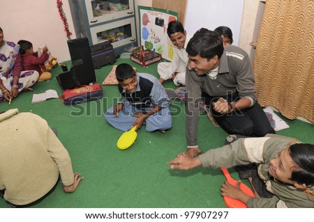 BHOPAL- DECEMBER 7:  New generation victims of the Bhopal gas disaster -most of them suffering from cerebral palsy playing in a rehabilitation clinic in Bhopal - India on December 7, 2010.