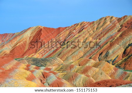 ZHANGYE, CHINA - JULY 27:  Danxia landform on July 27, 2013 in Zhangye, China. Danxia landform is formed from red sandstones and mineral deposits being laid down over twenty four million years.