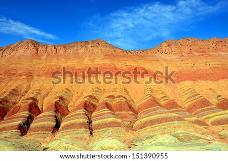 ZHANGYE, CHINA  JULY 27:  Danxia landform on July 27, 2013 in Zhangye, China. Danxia landform is formed from red sandstones and mineral deposits being laid down over twenty four million years.