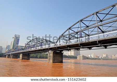 LANZHOU, CHINA - JULY 31:  Zhongshan Iron Bridge on July 31, 2013 in Lanzhou, China. Zhongshan Iron Bridge was the first bridge built on the Yellow River and is 233 meters long.