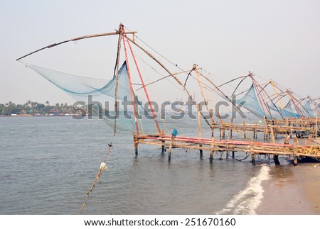KOCHI, INDIA - JANUARY 31, 2015: Chinese fishing nets have been used for the last 500 years and become a popular tourist attraction. These were introduced by Portuguese settlers from Macau.