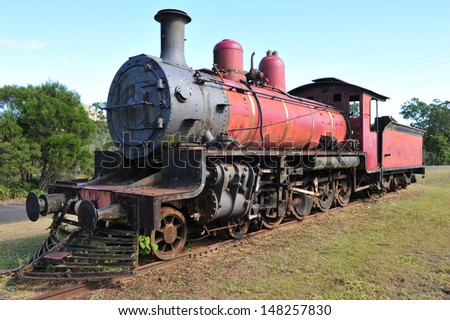 old rusting steam locomotive train wreck on tracks yesteryear transportation bygone era, australia