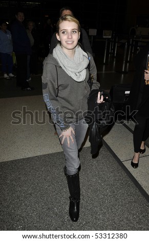 LOS ANGELES - FEBRUARY 9: Actress Emma Roberts niece to actress Julia Roberts is seen all smiles a she makes her way thru LAX (lLos Angeles Airport). February 9, 2010 in los angeles, california