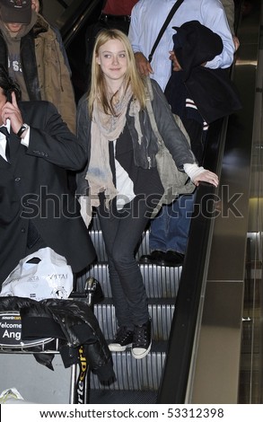 LOS ANGELES - JANUARY 25: Actress Dakota Fanning is seen all msiles as she arrives at LAX airport. January 25, 2010 in los angeles, california