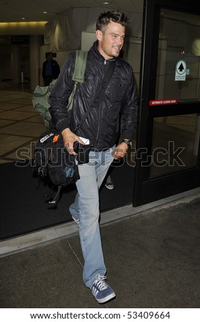 LOS ANGELES - APRIL 24: Actor Josh Duhamel husband to rocker Fergie from the Black Eyed Peas is seen on the telephone at LAX. April 24, 2010 in Los Angeles, California