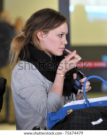 LOS ANGELES - FEBRUARY 11: Singer actress Hillary Duff is seen at LAX airport .February 11, 2010 in Los Angeles, California