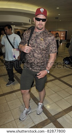 LOS ANGELES-APRIL 5: Wrestler Stone Cold Steve Austin at LAX airport. April 5, 2011 in Los Angeles, California