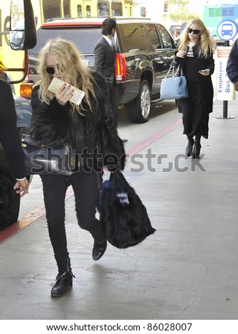 LOS ANGELES-APRIL 06: The Olsen Twins at LAX airport. April 06 in Los Angeles, California 2011