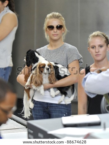 LOS ANGELES-SEPTEMBER 19: Television presenter Julianne Hough with her dogs at LAX airport. September19 in Los Angeles, California 2011