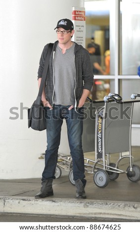 LOS ANGELES-APRIL 30: Glee actor Cory Montieth at LAX airport. April 30 in Los Angeles, California 2011