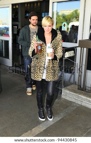 LOS ANGELES-OCTOBER 30: Singer Ashlee Simpson with boyfriend arrive at Los Angeles airport. October 30, 2011 in Los Angeles, California