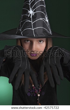 portrait of an eleven years old girl dressed as a witch