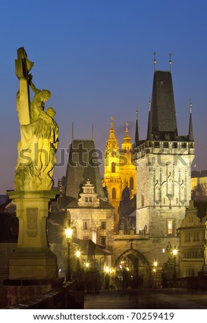 czech republic prague - charles bridge and st. nicolaus church at dusk