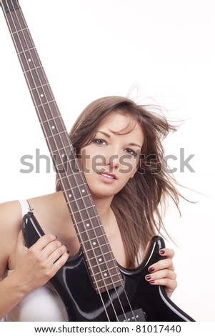 young female bass guitar player in red top - isolated on white