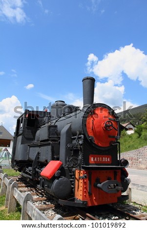 old steam red train at Dolomites, Italy
