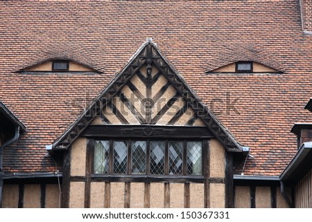 Cecilienhof Palace with eyes painted on the roof, was the unesco world heritage in Potsdam, Germany