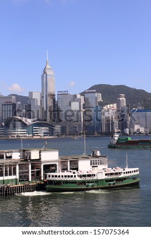 HONG KONG - JUNE 30: Star Ferry at Tsimshatsui pier on June 30, 2013 in Hong Kong, China. Star Ferry has been in operation at Victoria Harbor for more than 120 years.