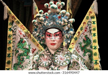 HONG KONG - JUNE 27, 2014 : Cantonese opera dummy with traditional makeup on June 27, 2014 in Hong Kong. Originating in southern China, Cantonese opera is a popular theatrical art in Hong Kong.